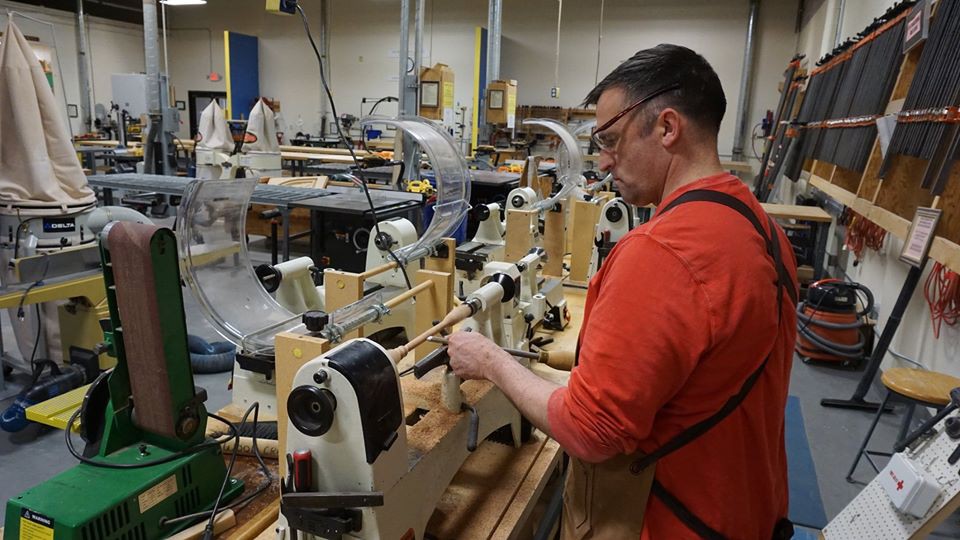 Colonel-working-in-shop